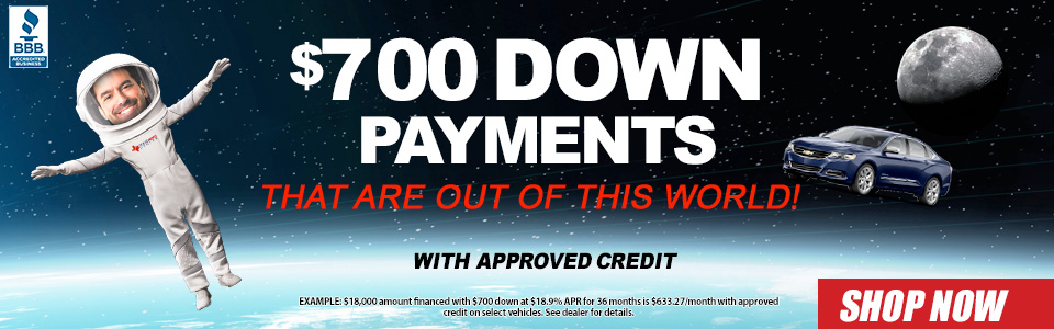Astronaught in space talking about low prices with 700 down. Down payments starting at $700. Shop now.